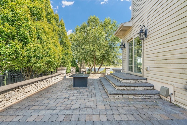 view of patio / terrace with a fire pit