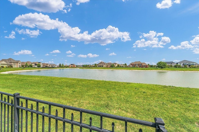 water view featuring fence and a residential view