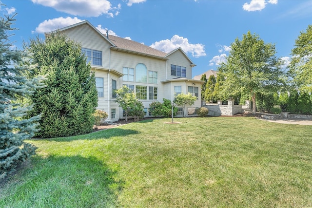 rear view of house with a lawn