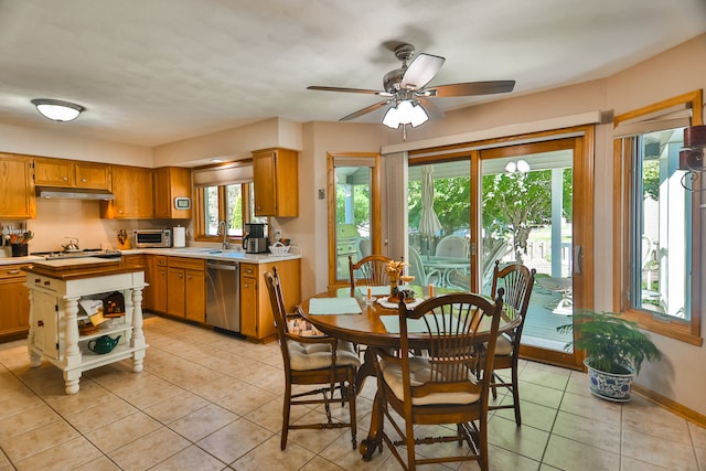 interior space with light tile patterned flooring, sink, and ceiling fan