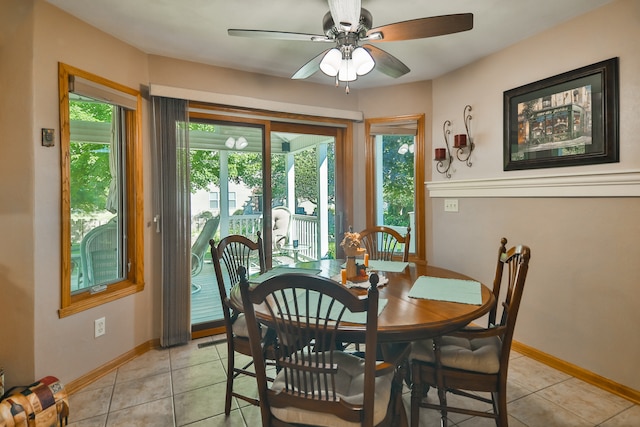 tiled dining area featuring ceiling fan