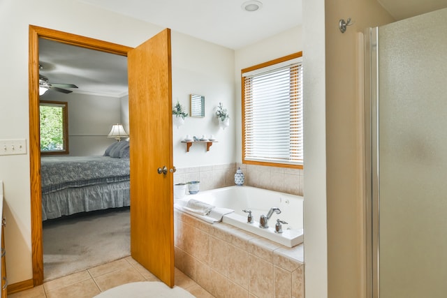 bathroom with plenty of natural light, plus walk in shower, ceiling fan, and tile patterned floors