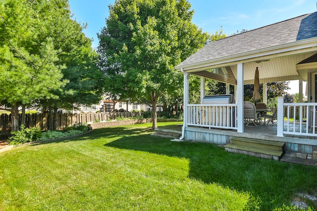 view of yard with a wooden deck