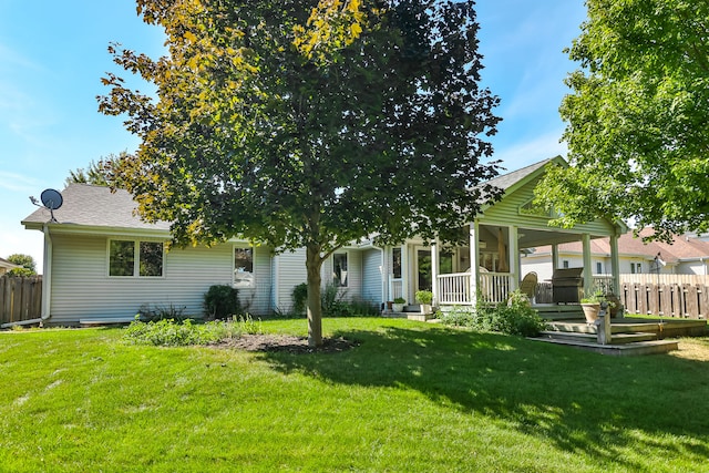 back of house featuring a yard