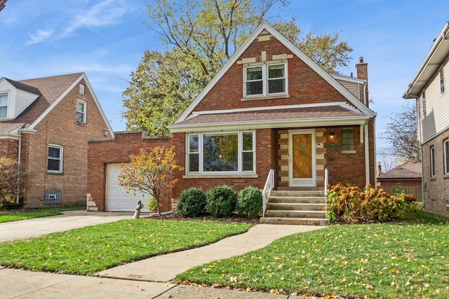 view of front of house with a garage and a front yard