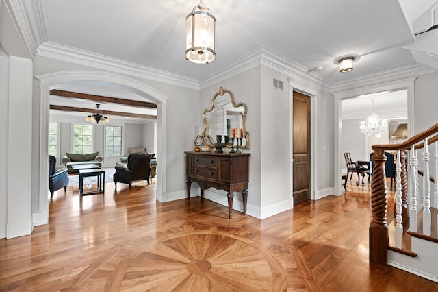 entrance foyer with crown molding, beam ceiling, a notable chandelier, and light hardwood / wood-style flooring