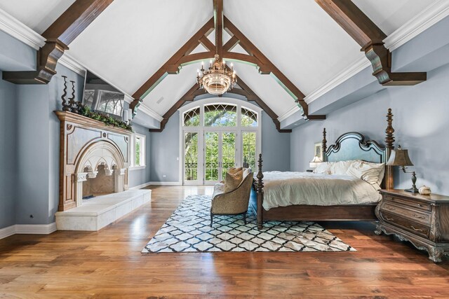 bedroom featuring beamed ceiling, high vaulted ceiling, crown molding, a chandelier, and wood-type flooring