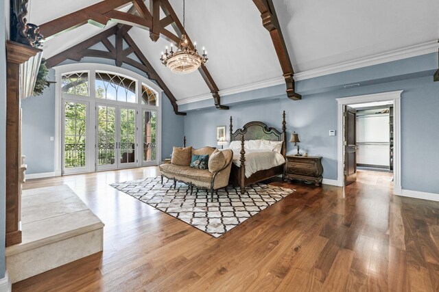 bedroom with an inviting chandelier, hardwood / wood-style floors, beamed ceiling, access to outside, and high vaulted ceiling