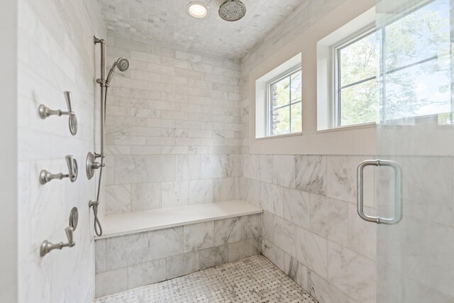 bathroom featuring a shower with door