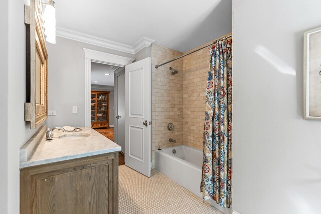 bathroom featuring ornamental molding, vanity, tile patterned flooring, and shower / bath combo