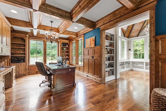 office area featuring hardwood / wood-style floors, plenty of natural light, and an inviting chandelier