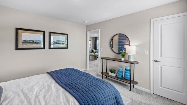 bedroom featuring light colored carpet