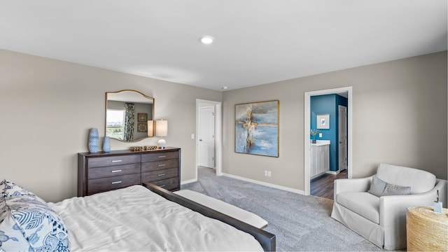 carpeted bedroom with ensuite bath