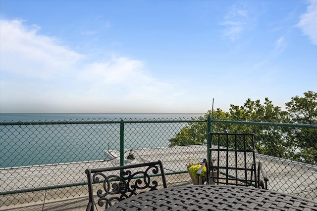 balcony featuring a water view