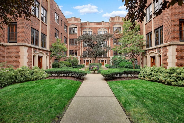 view of community featuring a yard