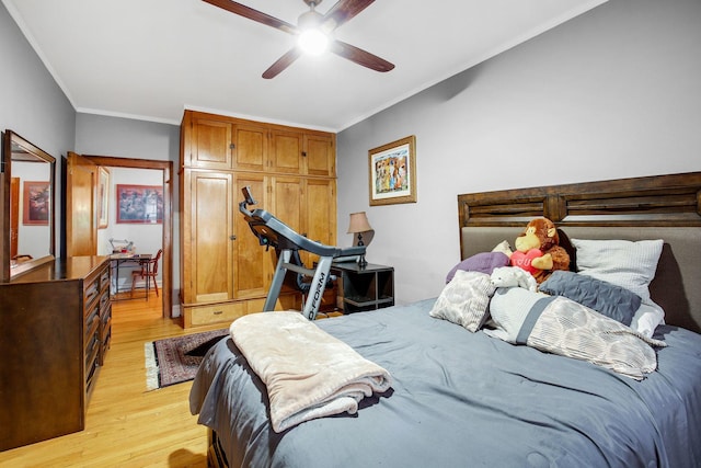 bedroom featuring light wood-type flooring, ceiling fan, and ornamental molding