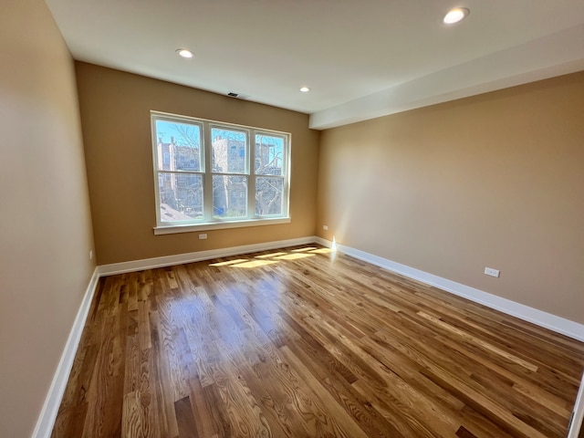 unfurnished room featuring hardwood / wood-style floors