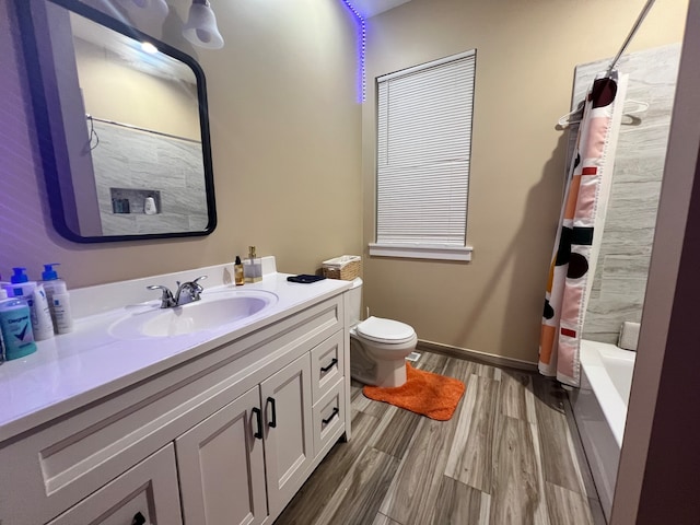 full bathroom featuring vanity, toilet, shower / bath combination with curtain, and hardwood / wood-style flooring