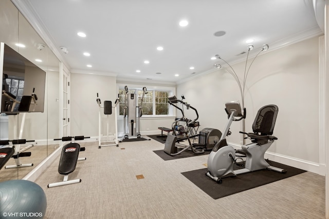 workout area with carpet floors and crown molding