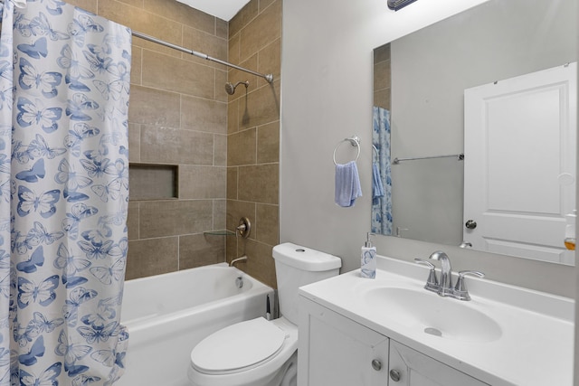 full bathroom featuring shower / bath combo with shower curtain, vanity, and toilet