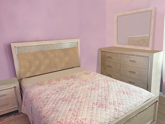 bedroom with dark wood-type flooring