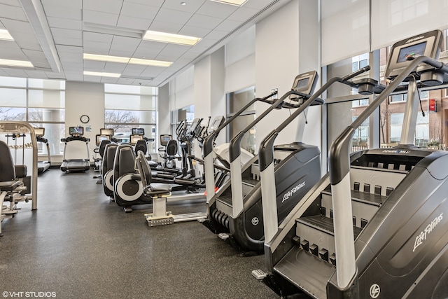 exercise room featuring a paneled ceiling