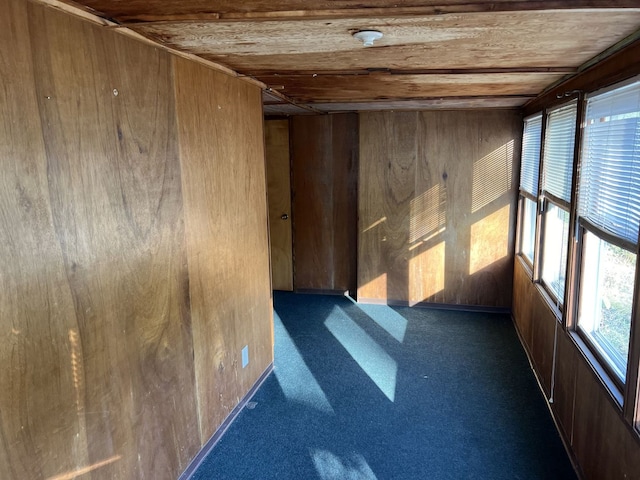 unfurnished sunroom featuring wooden ceiling