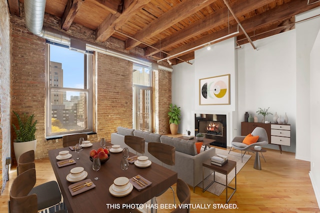 living room featuring wood ceiling, brick wall, beam ceiling, and light wood-type flooring