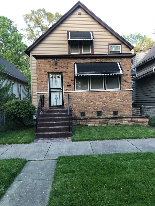 view of front facade featuring a front yard