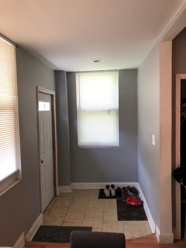 tiled entryway with plenty of natural light