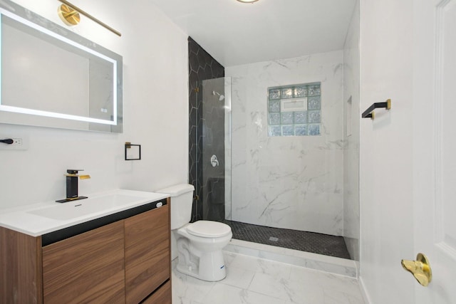 full bathroom with vanity, toilet, marble finish floor, and a marble finish shower