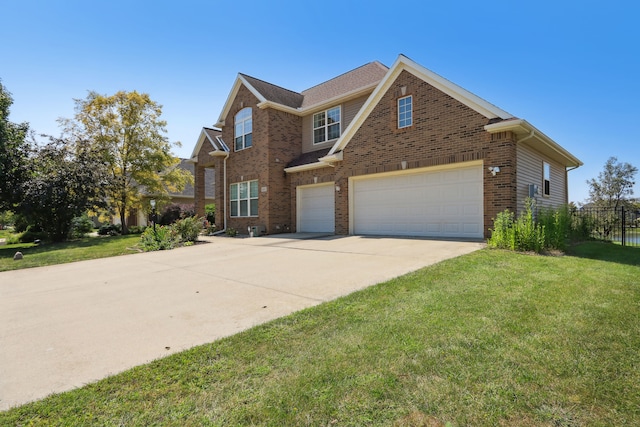 view of front of home featuring a garage and a front lawn