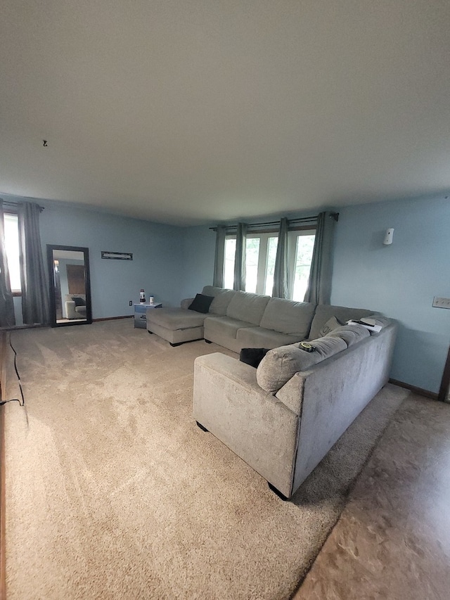 carpeted living room featuring a wealth of natural light