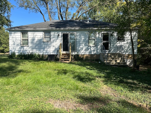 back of house with a yard