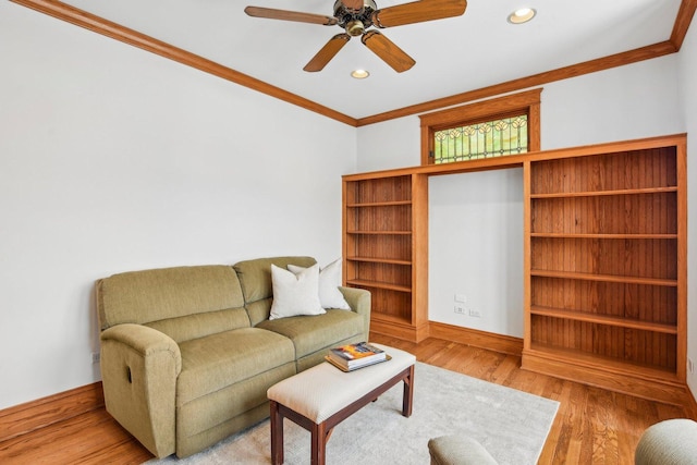 living room with ceiling fan, light hardwood / wood-style flooring, and ornamental molding