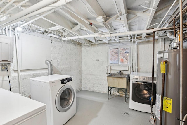 laundry room featuring washing machine and dryer, sink, electric panel, and water heater