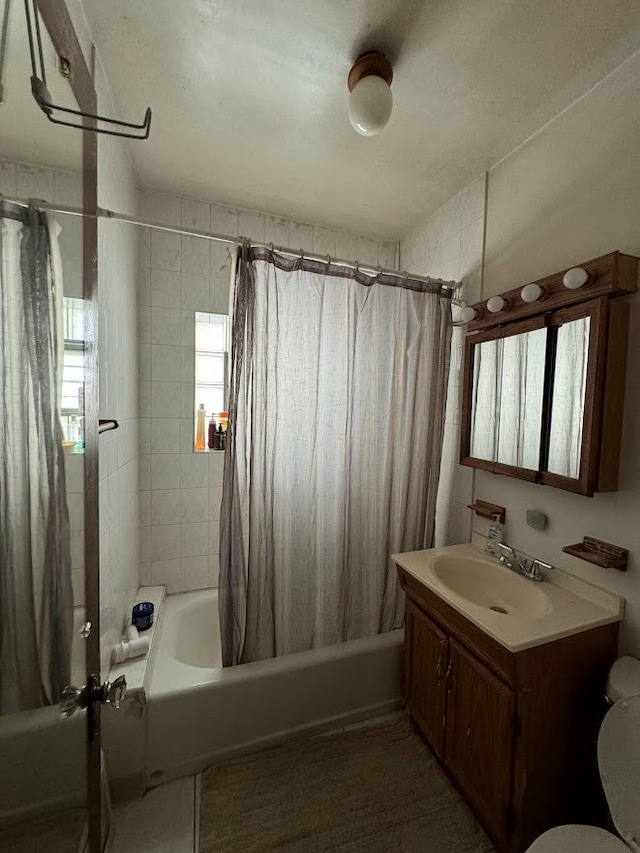 full bathroom with vanity, toilet, and shower / bath combination with curtain