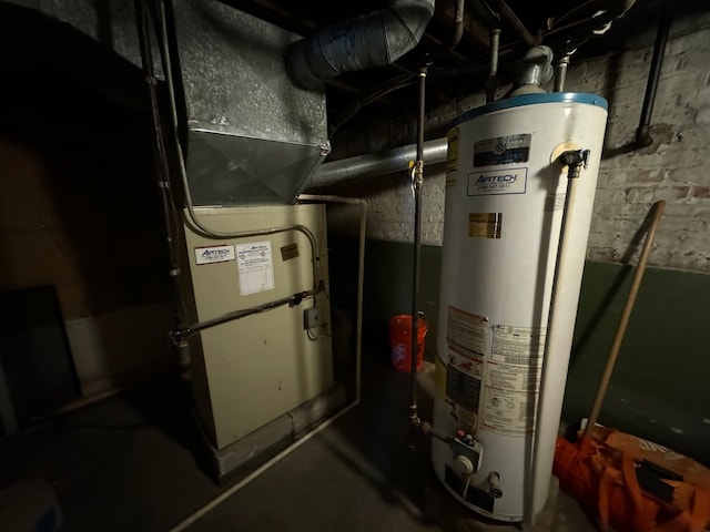 utility room featuring water heater