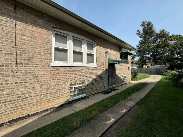 view of property exterior featuring a yard