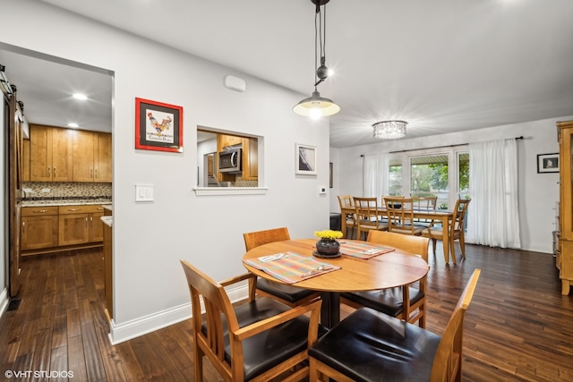 dining space featuring dark hardwood / wood-style floors