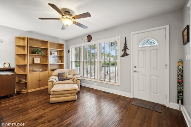 foyer entrance with ceiling fan and dark hardwood / wood-style floors