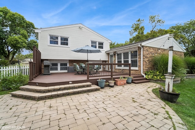 back of property with a patio area and a deck