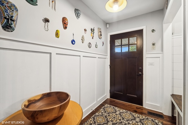 entryway with dark hardwood / wood-style floors