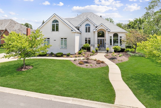 view of front of property with a front lawn