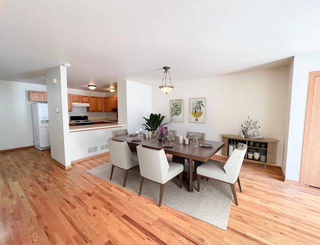 dining area featuring light hardwood / wood-style flooring