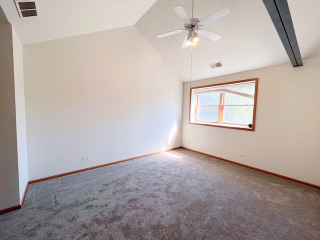 empty room featuring ceiling fan, vaulted ceiling with beams, and carpet floors