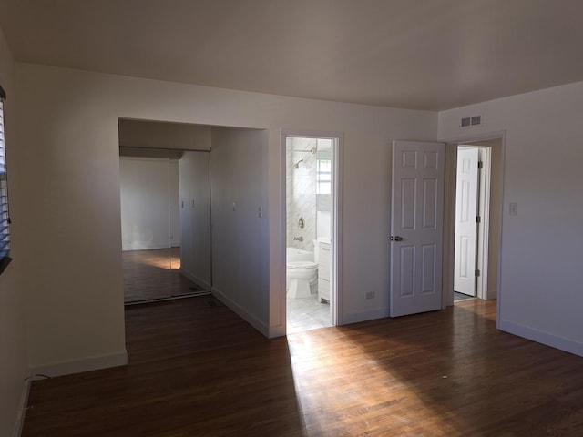 empty room with dark hardwood / wood-style floors