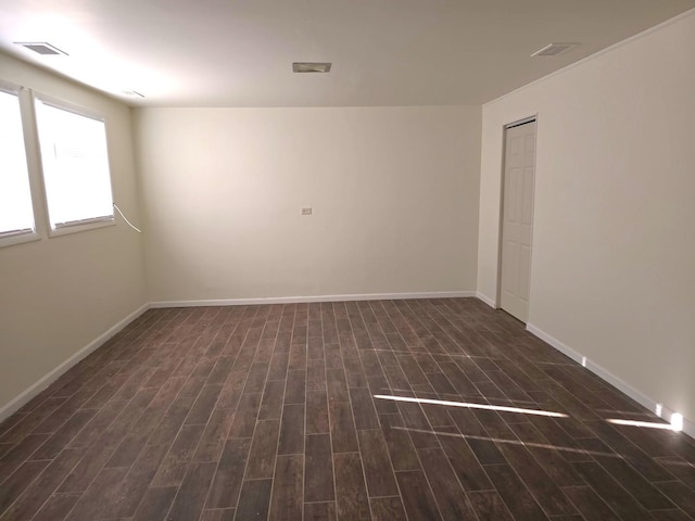 spare room with dark hardwood / wood-style flooring