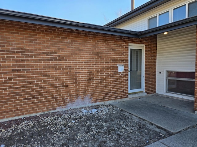 property entrance featuring a patio