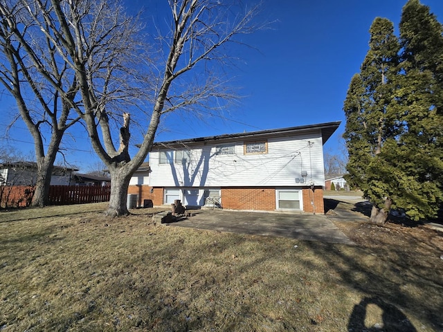 back of house featuring a yard